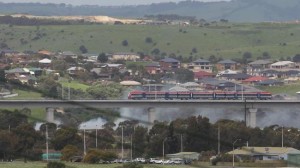 Electric train  travelling on the new bridge over the Onkaparinga River at Noarlunga Downs this week. Picture: Stephen Laffer.